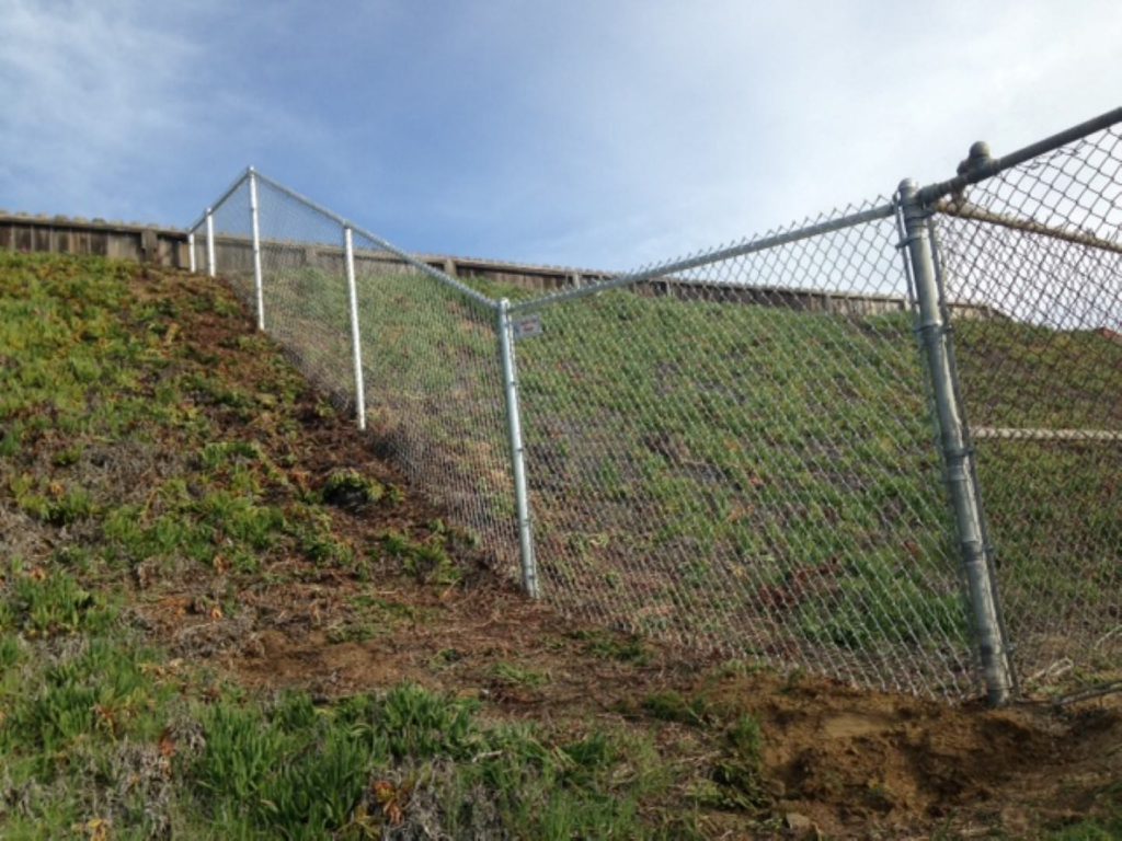 Install chain link fence slope
